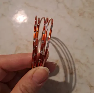 Set bracciali arancione e argento