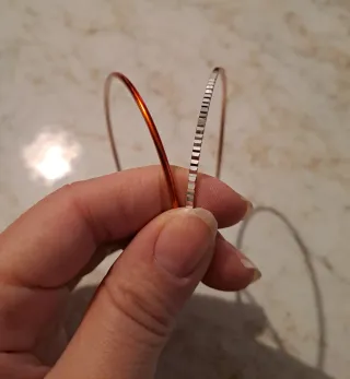 Set bracciali arancione e argento