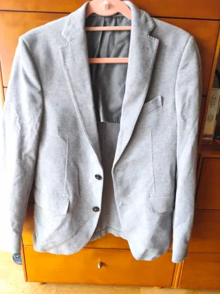 Americana niño gris.