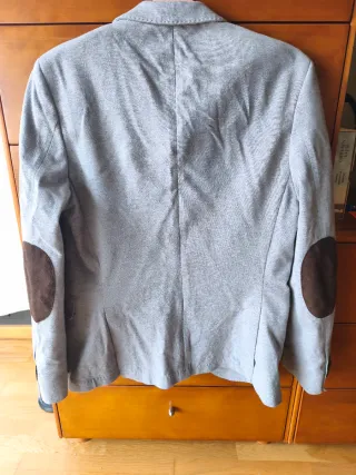 Americana niño gris.