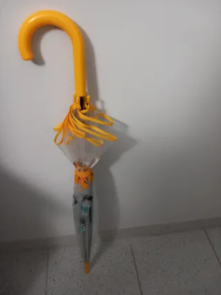 Paraguas mediano transparente con detalles amarill