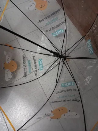 Paraguas mediano transparente con detalles amarill