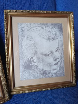 Coppia stampe artistiche con cornice dorata