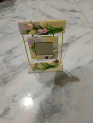 Portafoto altalena con coccinella