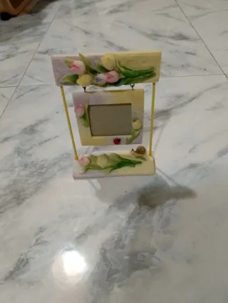 Portafoto altalena con coccinella