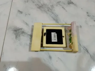 Portafoto altalena con coccinella