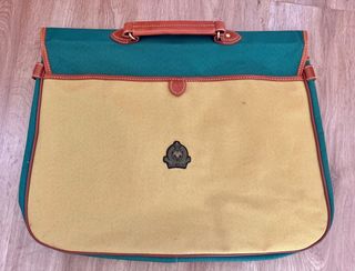 Maletín de lona verde y amarillo