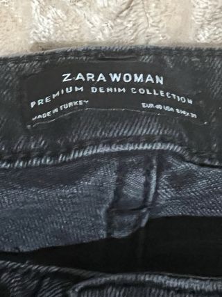 Pantalón vaquero negro L con pedrería.