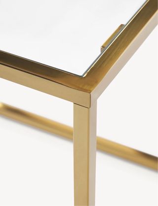 Mesa de centro cristal y metal dorado