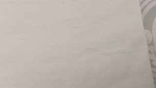 Sábana antigua bordada y castañuelas.