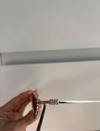 Gafas de sol Miu Miu diamante doradas