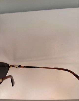 Gafas de sol Miu Miu diamante doradas