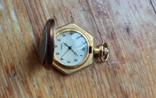 Orologio da tasca esagonale dorato