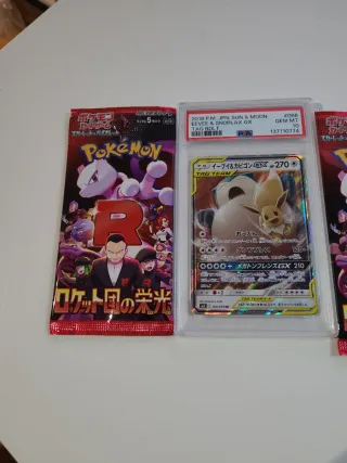 PSA 10 Eevee & Snorlax GX + 2 sobres Pokémon