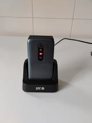 Teléfono móvil SPC con base y cargador