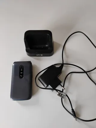 Teléfono móvil SPC con base y cargador