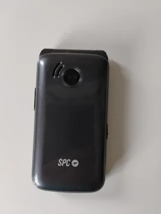 Teléfono móvil SPC con base y cargador