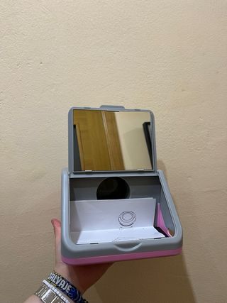 Mini proyector gris y rosa