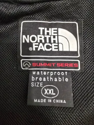 The North Face impermeable azul y gris oscuro