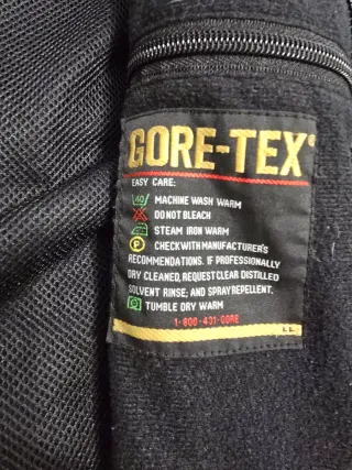 The North Face impermeable azul y gris oscuro