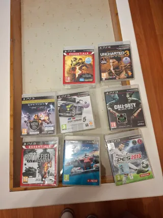 PlayStation 3 con volante, mandos y juegos