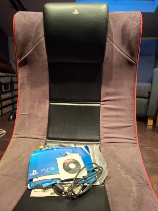 PlayStation 3 con volante, mandos y juegos