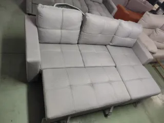 Sofá cama con baúl de tela gris nuevo a estrenar