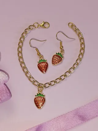 Pulsera y pendientes dorados de fresas