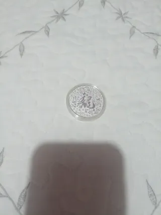 Moneda china con Baño de Plata