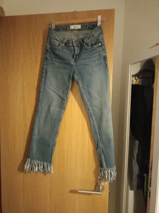 Pantalón vaquero flecos