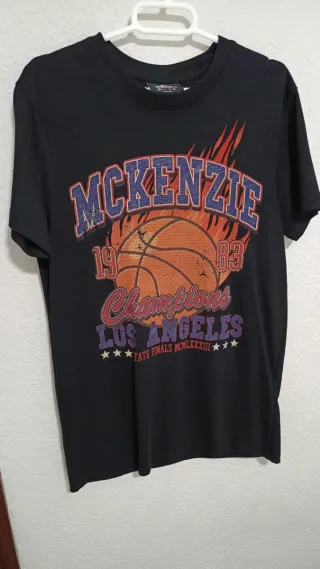 Camiseta McKenzie Negra Baloncesto Champions nueva