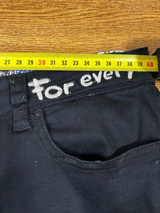 Pantalones Desigual negros con flor