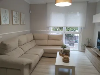 Sofá esquinero beige tela