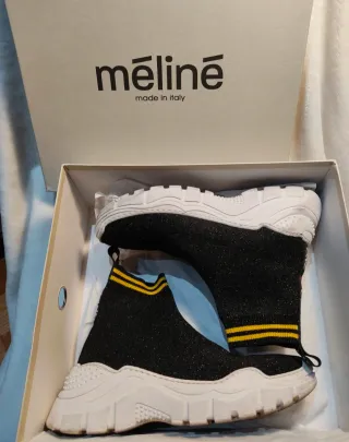 Botines Mēlinē Negros y Dorados