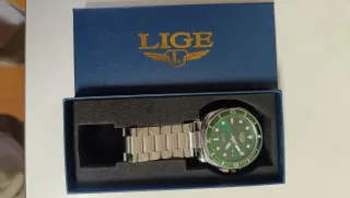 Reloj  Verde y Plateado de acero inoxidable