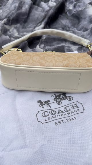 Bolsa de mano Coach beige y dorada
