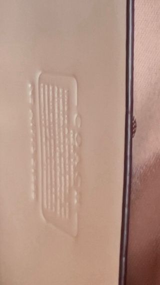 Bolsa de mano Coach beige y dorada