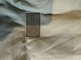 Piumino Fila smanicato grigio