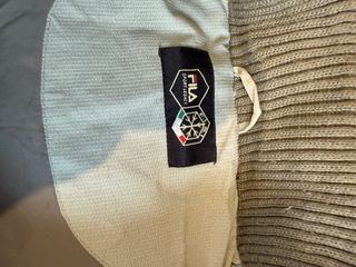 Piumino Fila smanicato grigio