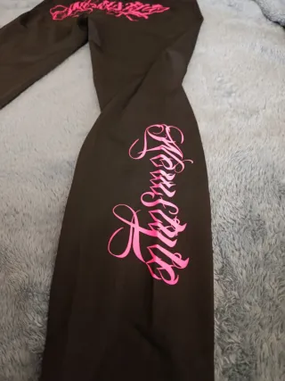 Mallas Newstyle negras con detalle rosa