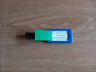 Cartellino per bagaglio blu e verde