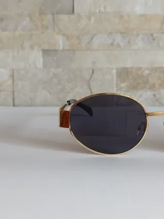 Occhiali da sole ovali oro e neri