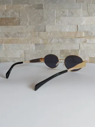 Occhiali da sole ovali oro e neri
