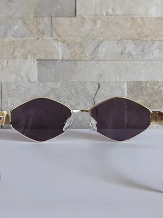 Occhiali da sole oro e neri