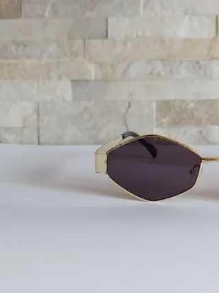 Occhiali da sole oro e neri