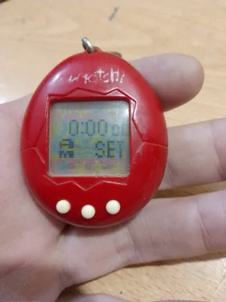 TAMAGOTCHI BANDAI 1997 ROJO