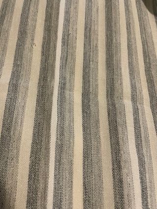 Pantalón fluido rayas beige y gris