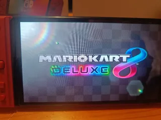 Nintendo Switch OLED blanco y joycon rojos nuevos