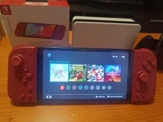 Nintendo Switch OLED blanco y joycon rojos nuevos