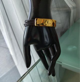 Pulsera Uno de 50 dorada con piedra